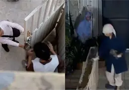 VIDEO | Captan a dos mujeres arrojando y embarrando supuesto excremento en edificio de Coyoacán